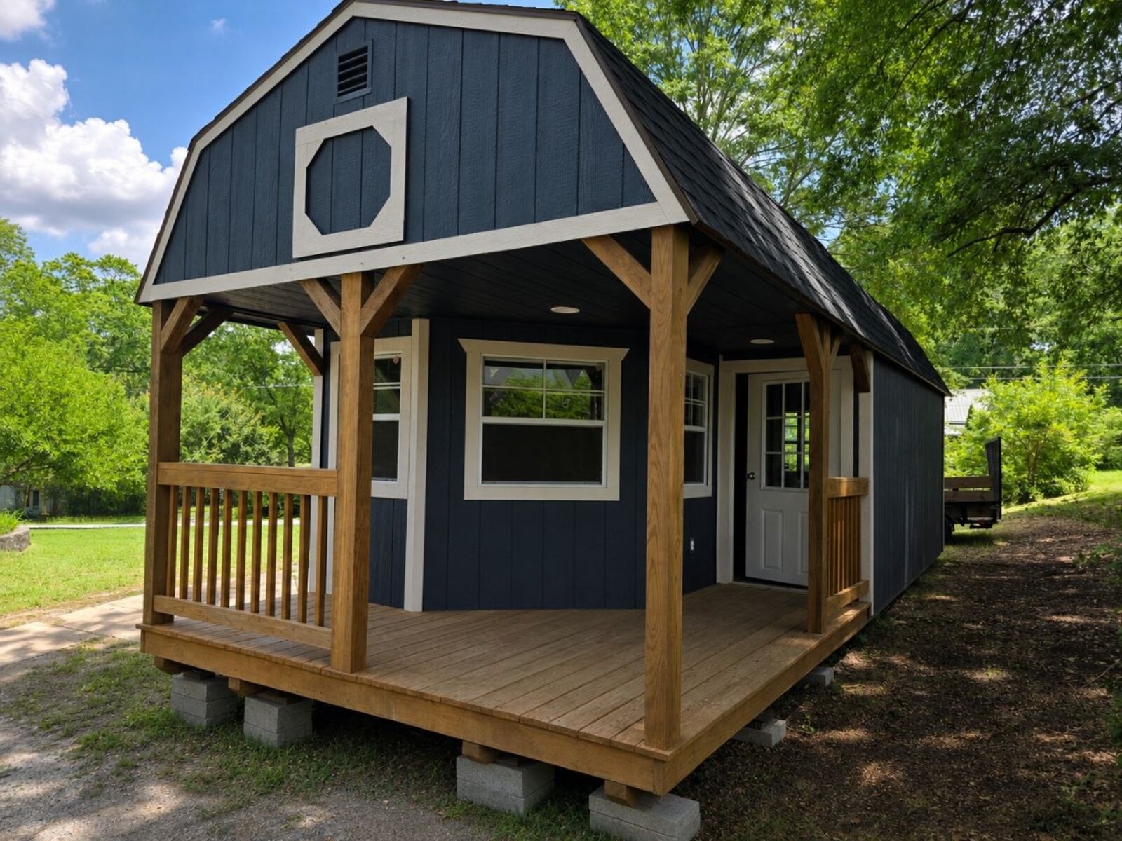 Completed exterior of the 12x24 tiny home with covered porch